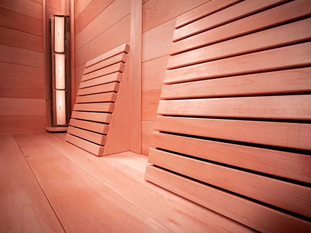 Close up of wood panelled seating in infrared sauna